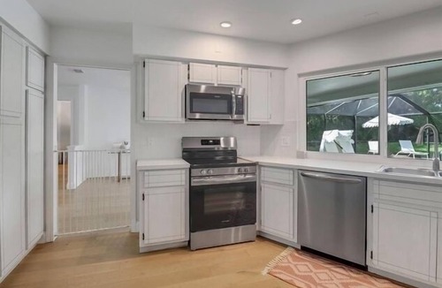 Moorings House | Walk to beach from home in The Moorings . Private heated pool & Pet-friendly.n