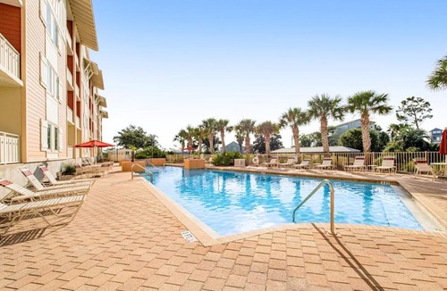 Waterside Village House | Waterfront Home Close to Beach with Shared Pool Hot Tub Free WiFi & Central AC