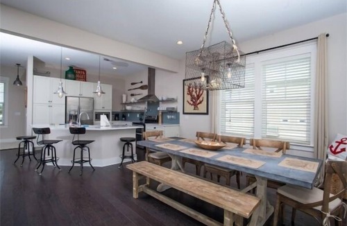 Navarre Beach House | Waterfront Home with Golf Cart, Kayaks, Bikes and Paddleboards!