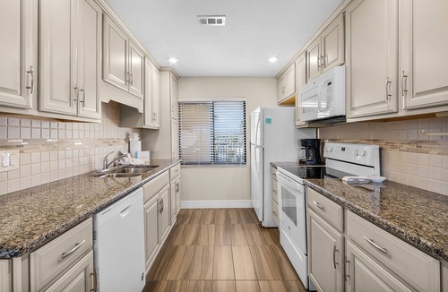 Mid Island Condo | Weekly Discount! 126 Charming Beachfront 2BR/2BA Condo w/Balcony