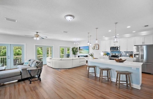 Butler Beach House | Welcome Basket, Swim Spa, Steps to Beach, BBQ!