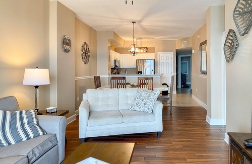 Panama City Beach Condo | Welcoming waterfront condo with a furnished balcony, pool & pool spa