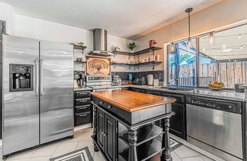 Garland House | Wonderful 3-bedroom retreat with Foosball, BBQ Grill, Pool, and Covered Patio