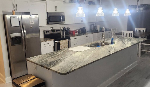 3-bedroom house in serene Vero Beach with AC comfort. Huge screened in patio