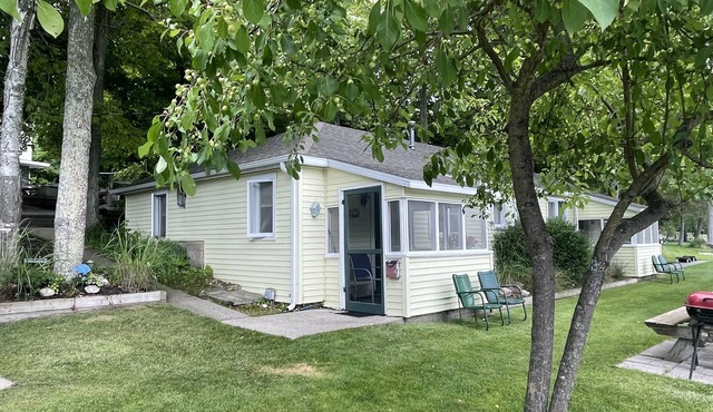 Cottage 1 is a charming 2 bedroom only 25’ from its boat dock & Hamlin lake. in Ludington