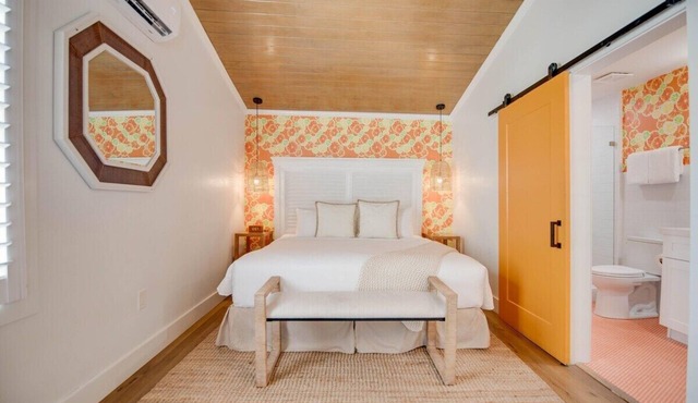 Feather Queen at Custom House Inn | Two Vibrant Suites!