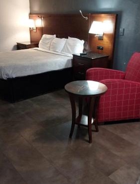 Gated Queen Bed Hotel Suite 217