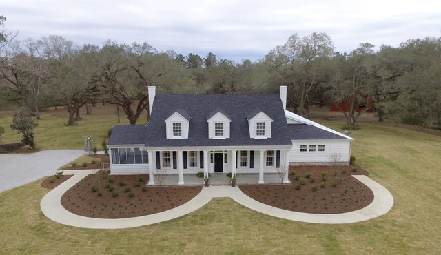 Gorgeous Stately Home with Cascading Oaks