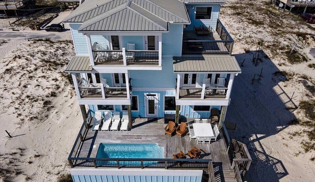 Happy Our is a Fabulous Gulf Front Home with 9 bedrooms and a Private Pool by Prickett Properties