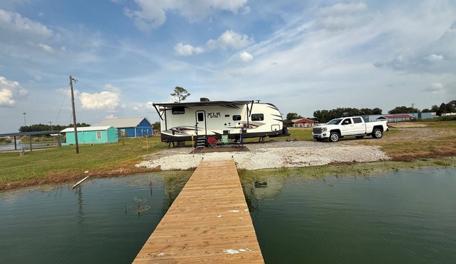 Relax or fish on this private pond and watch the most beautiful sunsets from RV