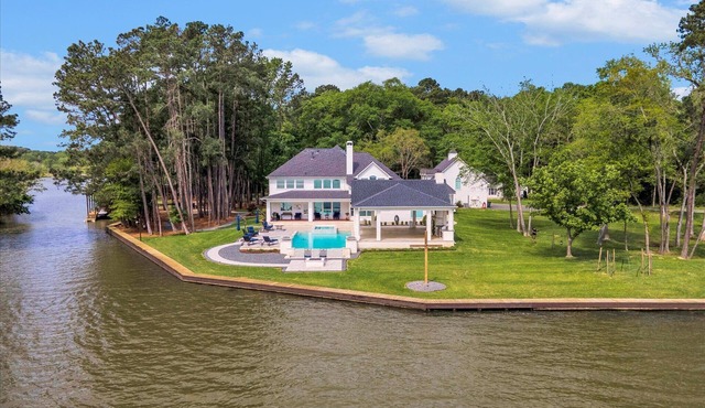SECLUDED LUXURY LAKEFRONT ESTATE. WOODED 2.6 ACRES OF PEACE AND RELAXATION.