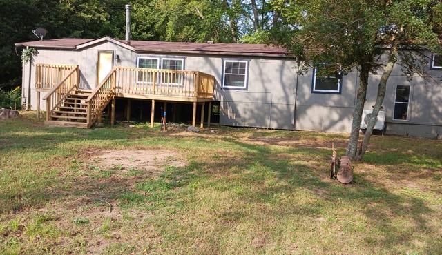 Spacious 4-bedroom mobile home 40 acres on Baron Fork 10 miles from Tahlequah in Welling