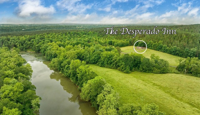 The Desperado Inn is a charming secluded cabin with Mountain Fork River access