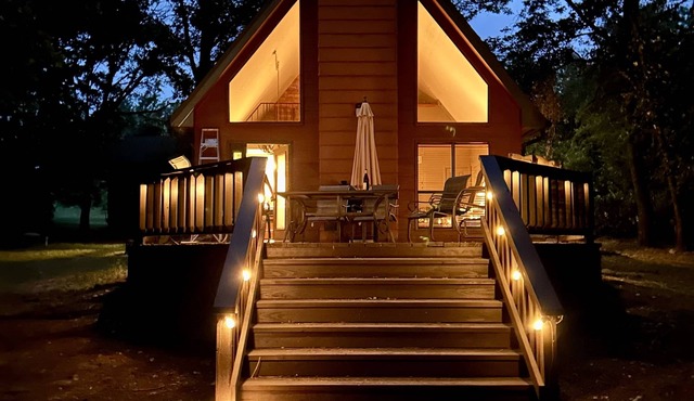This relaxing cabin is cozy and secluded with private pond and fishing dock
