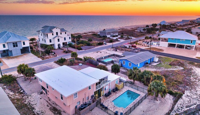TROUT Steps to beach. Lovely two bedroom with screened porch and pool.