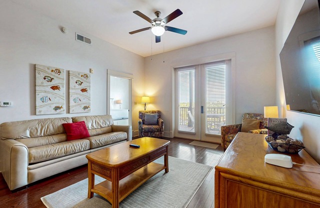 Polished condo with balcony & pools - one block from the beach