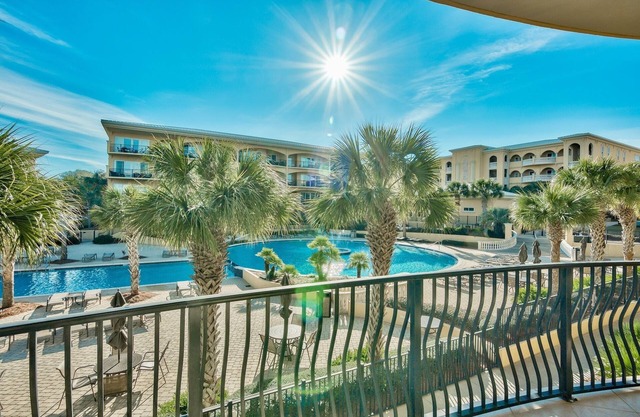 Spacious condo just steps to the private beach, heated pool, hot tub, gym!