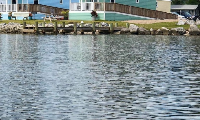 Eastpoint Cottage | (Fishing from dock) Boat launch, seafood market & bait-tackle shop next door.