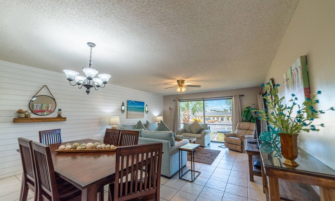 Panama City Beach Condo | Flamingo Sunset Edgewater Villa 907-2nd Floor End Unit-Golf & Pond Views-Free Beach Tram!