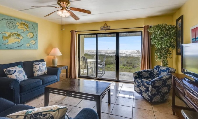 St. George Island Condo | HEAR THE ROAR of the ocean and the slow flapping of the blue herons.