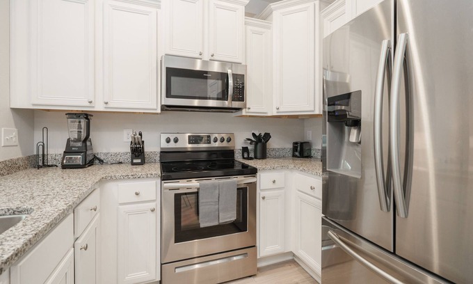 Thomas Drive House | Pride of PCB | 3BR Townhome, Pool Access, Patio, Near Beach, Sleeps 10