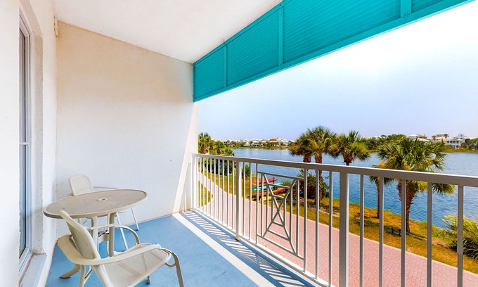 Sunnyside Apartment | Stylish condo with lake views, bike rentals, & pools - walk to the beach