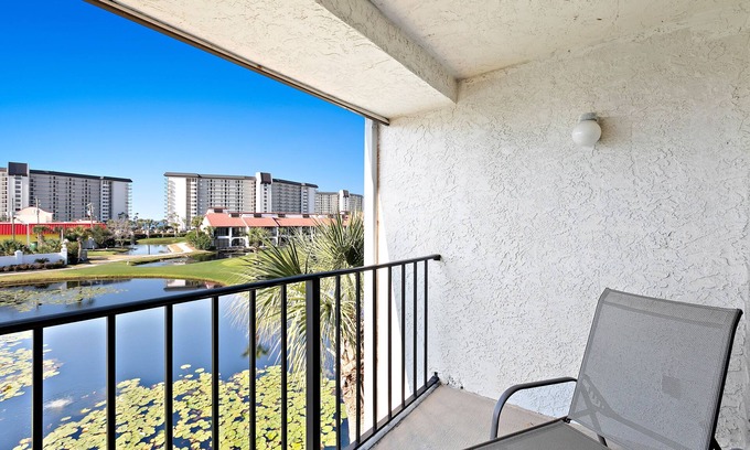 Panama City Beach Condo | Two-level waterfront condo near beach with balcony, patio, pool & hot tub