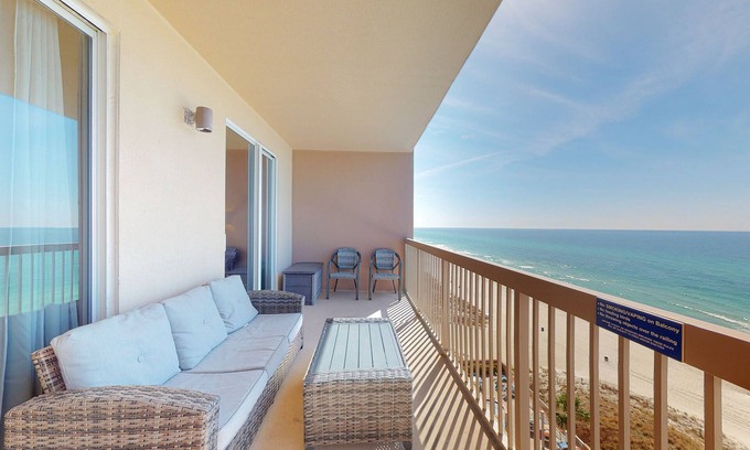 Panama City Beach Condo | Welcoming waterfront condo with a furnished balcony, pool & pool spa