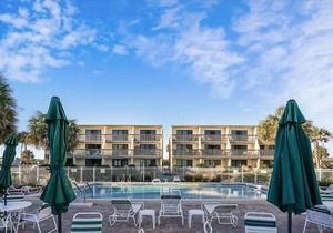 HEAR THE ROAR of the ocean and the slow flapping of the blue herons.