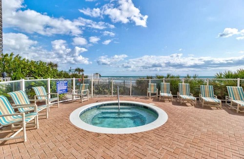 Daytona Beach Shores Apartment | Elegant Oceanfront Pool Hot Tub at Sanibel Condos