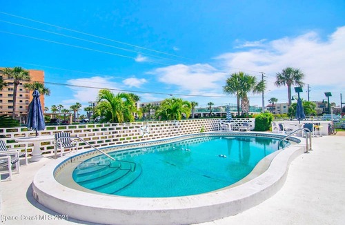 Port Canaveral Condo | Bottom Floor Corner Beach Condo w/Pool - Across Street From Beach