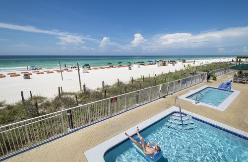West Panama City Beach Condo | Emerald Isle 1006 - Front row beach chair service included! Affordable rates!