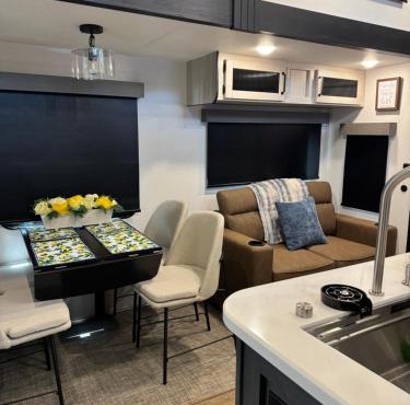 Extra large 4 bedroom with two full bath glamping rv with golf cart
